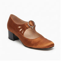 Brown leather pumps on a white background