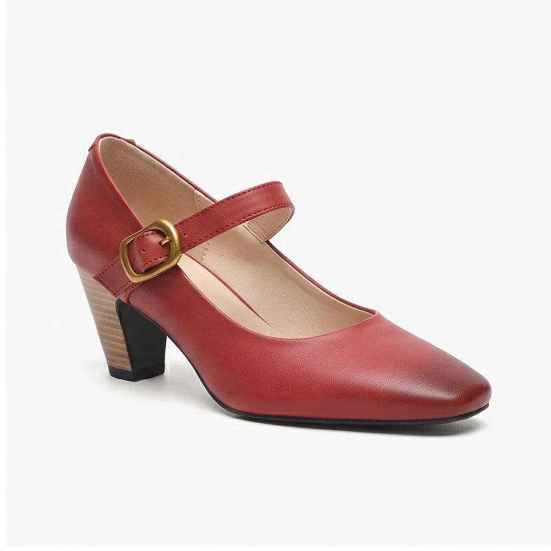 Red leather heels on a white background