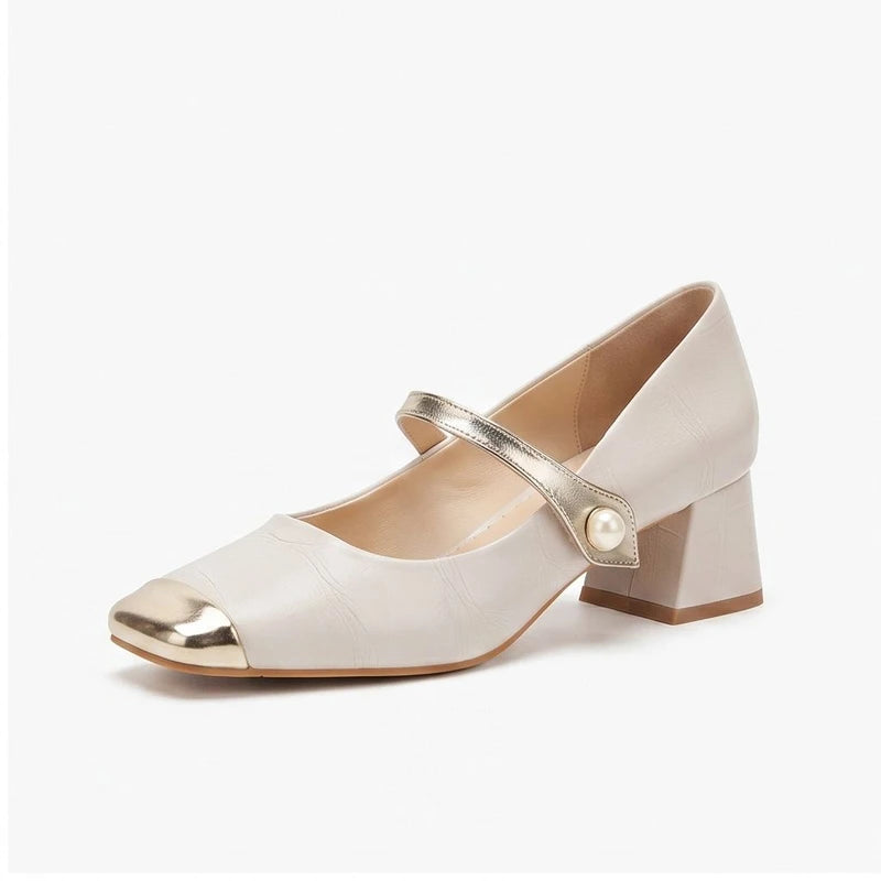 Ivory leather heels on a white background