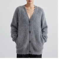 Model wearing Dark Gray cashmere cardigan in a studio