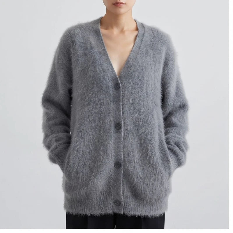 Model wearing Dark Gray cashmere cardigan in a studio