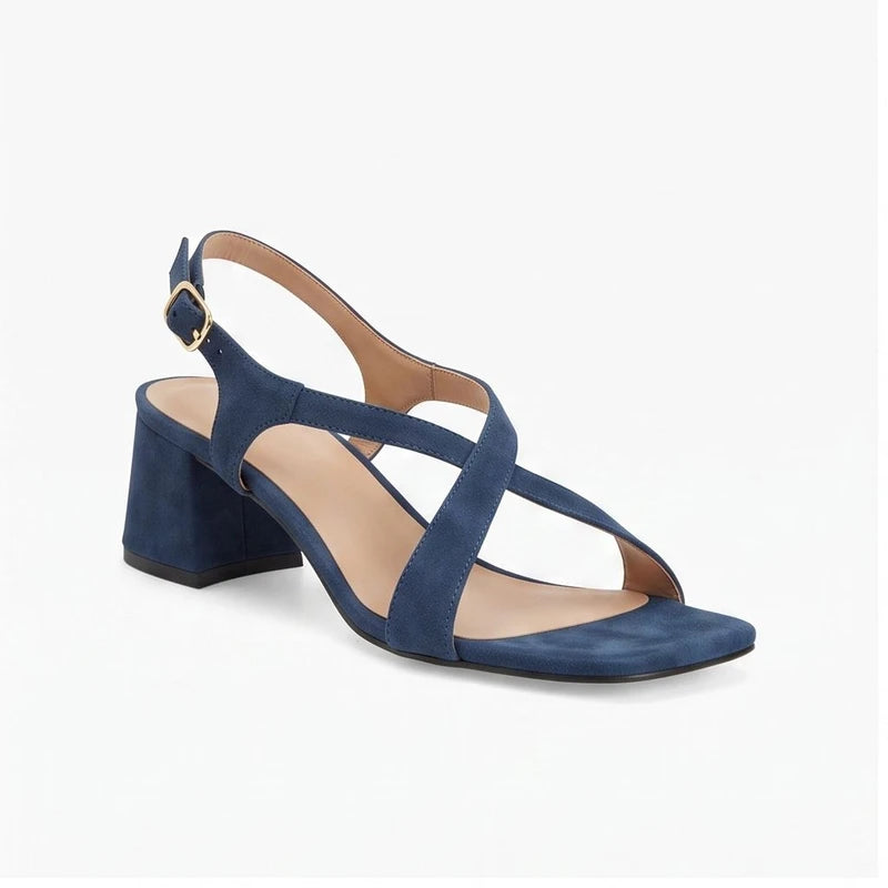 Blue suede sandals on a white background