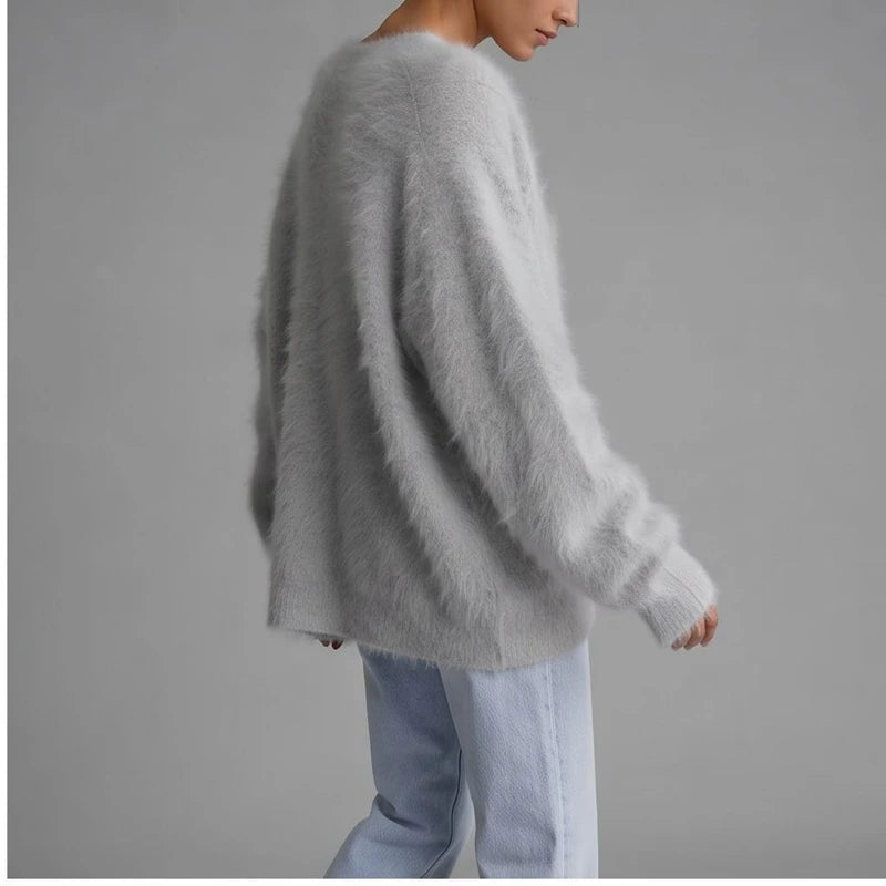 Model wearing Light Gray cashmere cardigan in a studio