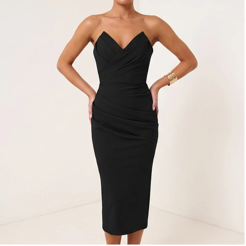 Model wearing Black dress in a studio