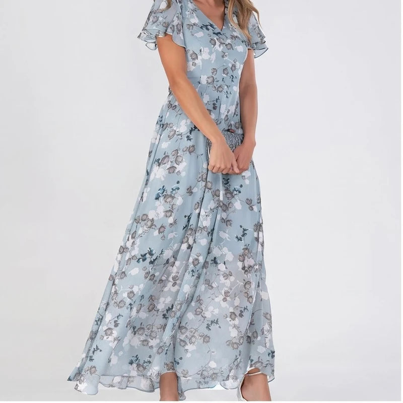 Model wearing Light Blue chiffon dress in a studio