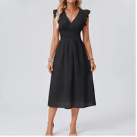 Model wearing Black dress in a studio