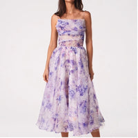 Model wearing Purple dress in a studio
