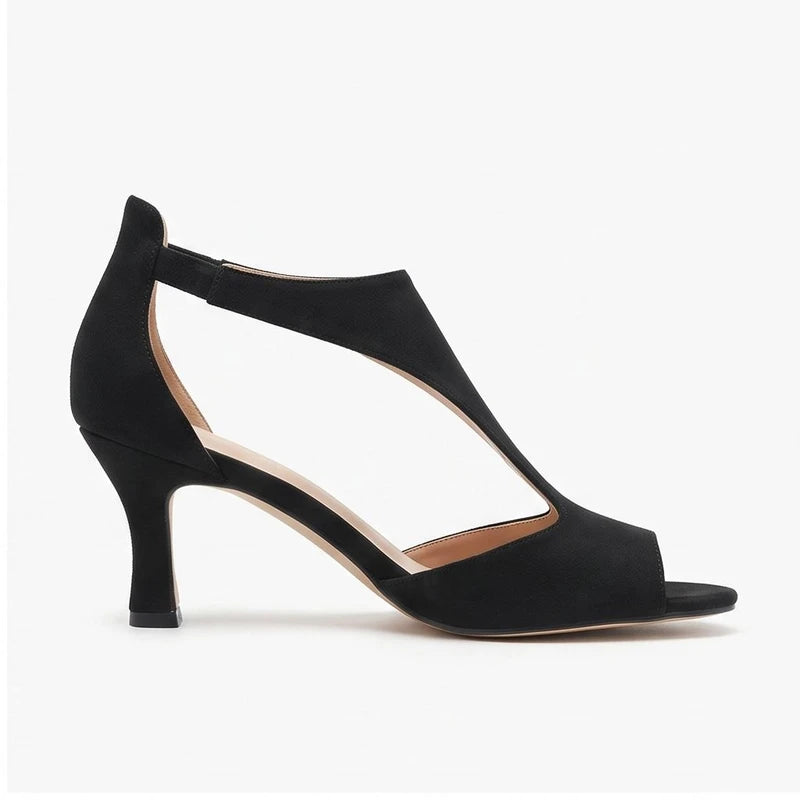 Black suede heels on a white background - 2