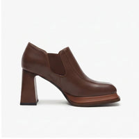 Brown leather heels on a white background - 2