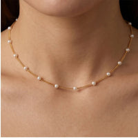 Model wearing Celestine Gold Pearl Necklace Celestine Gold Pearl Necklace close-up - 2