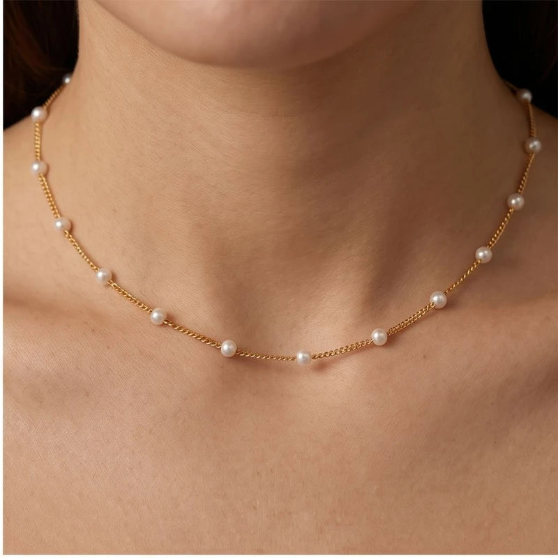 Model wearing Celestine Gold Pearl Necklace Celestine Gold Pearl Necklace close-up - 2