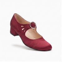 Red leather pumps on a white background