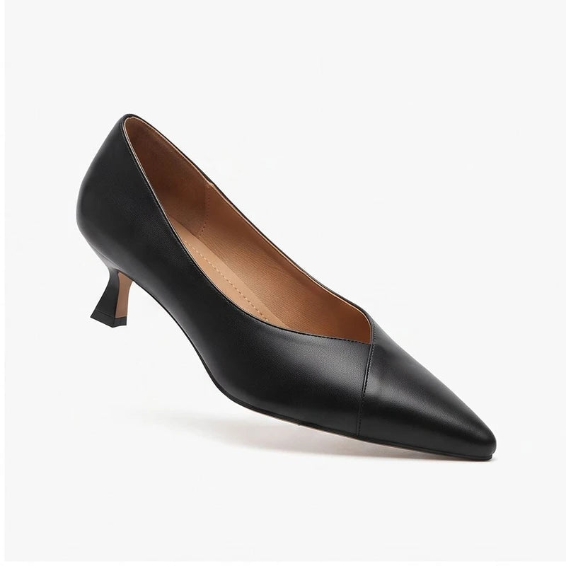 Black leather heels on a white background