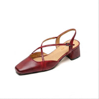 wine red leather sandals on a white background
