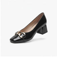 Black leather pump on a white background