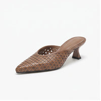 Brown leather mules on a white background