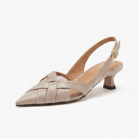 Beige leather heels on a white background