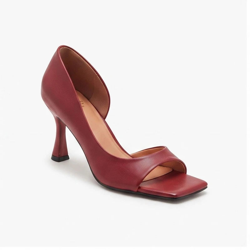 Red leather heels on a white background