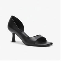 Black leather heels on a white background