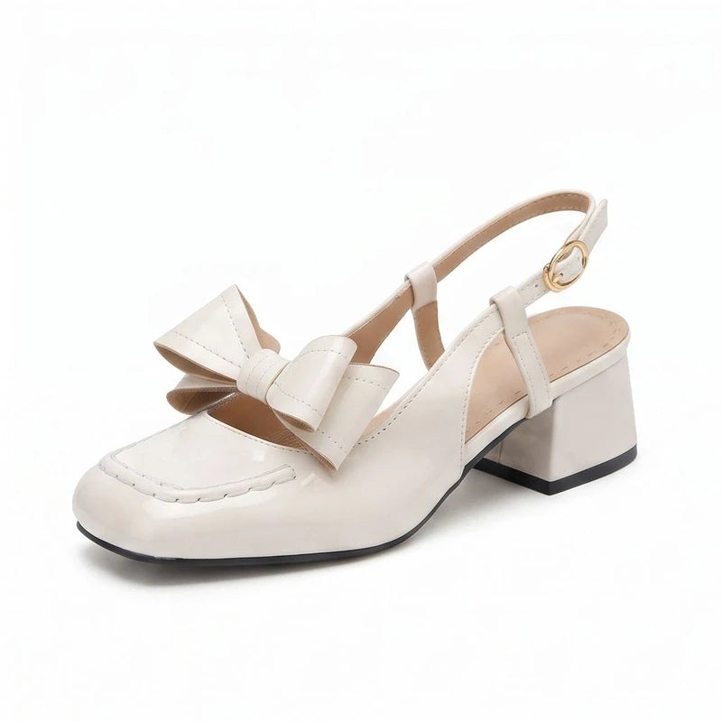 Ivory pumps on a white background