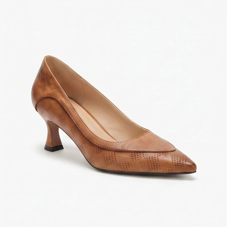 Brown leather heels on a white background