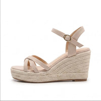 Beige sandals on a white background