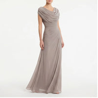 Model wearing Taupe dress in a studio