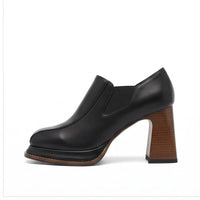 Black leather heels on a white background - 2