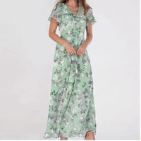 Model wearing Green chiffon dress in a studio