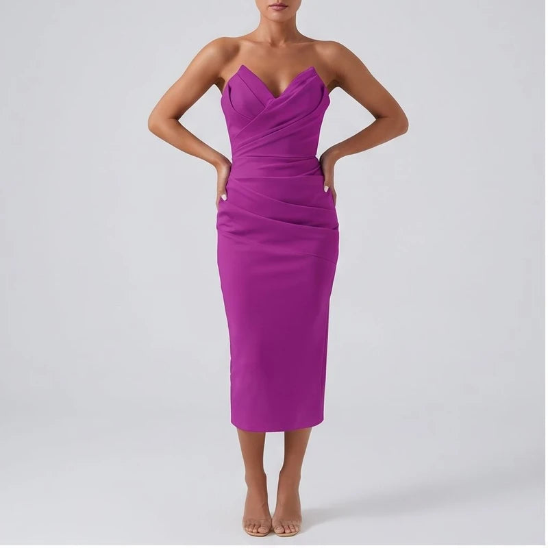 Model wearing Purple dress in a studio