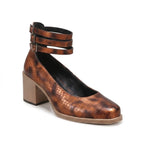 Brown pumps on a white background