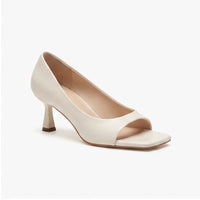 Cream leather heels on a white background