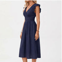Model wearing Navy dress in a studio - 2
