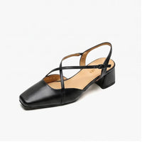 Black leather sandals on a white background