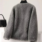 Gray fluffy cardigan on a mannequin against a white background