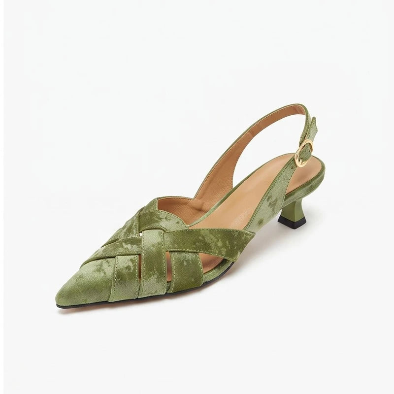 Green leather heels on a white background