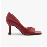 Red leather heels on a white background - 2