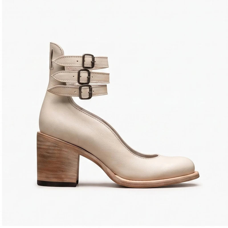 Cream leather boots on a white background