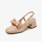 Beige pumps on a white background