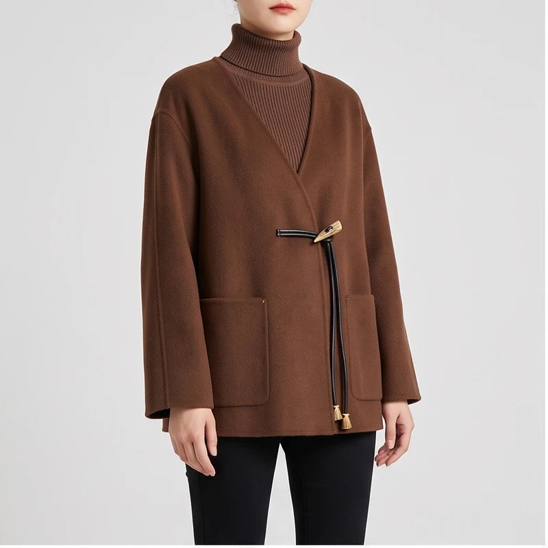 Model wearing Camel coat in a studio
