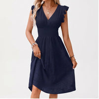 Model wearing Navy dress in a studio