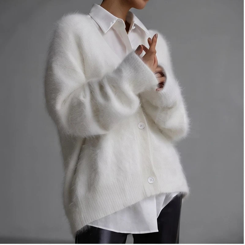 Model wearing White cashmere cardigan in a studio