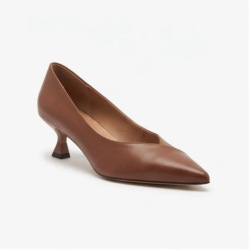Brown leather heels on a white background
