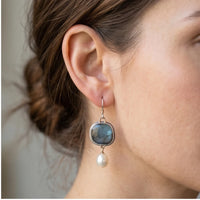 Model wearing Celeste Vintage Blue Gem & Pearl Drop Earrings Celeste Vintage Blue Gem & Pearl Drop Earrings close-up - 2