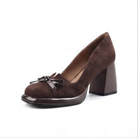 Brown suede heel on a white background