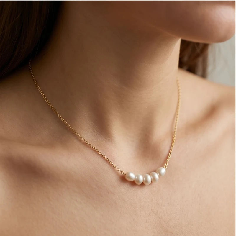 Model wearing Gold Aurea Pearl Necklace close-up - 3