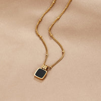 Solenne Gold Black Stone Pendant Necklace